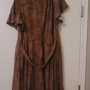 Lace like woman's dress from Torrd. Color is light marron